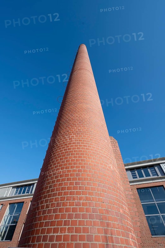 Former factory chimney in a new housing estate, Spardorf, Middle Franconia, Bavaria, Germany