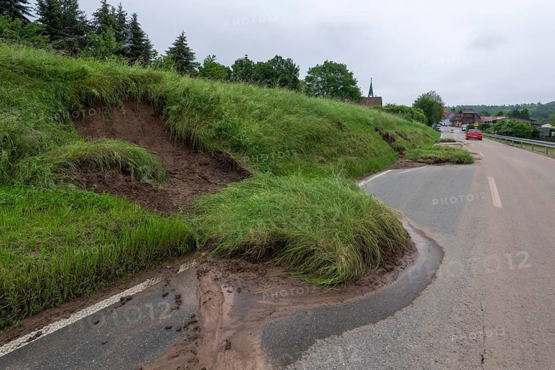 Symbolic image of climate change, slippery slope on a country road after heavy rainfall, near Berglen Hößlinswart, Baden-Württemberg, Germany