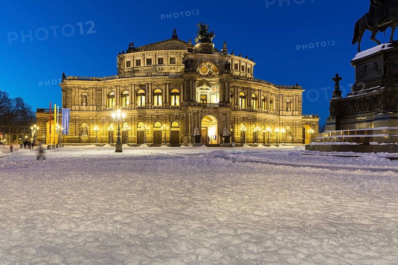 Illuminated Semper Opera House and Theatre Square with snow at dusk, Old Town of Dresden, Saxony, Germany