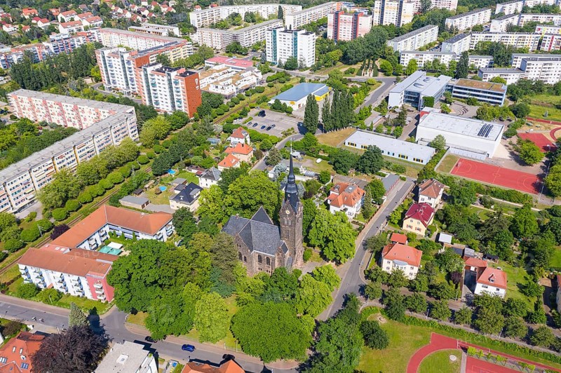 Aerial view of the New Church, in the background the grammar school and the new development area Dresdner Straße, Coswig, Saxony, Germany