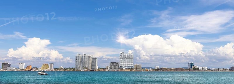 View from Deer Island, Isla de Venados, of famous Mazatlan sea promenade El Malecon, with ocean lookouts, luxury hotels, beaches and scenic landscapes