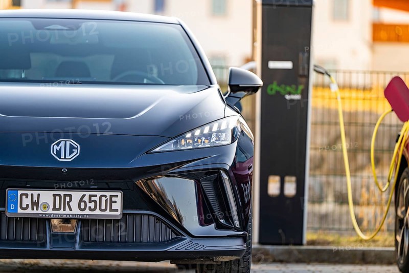 Front of a black electric car with licence plate next to a charging station, Deer E- Carsharing vehicle MG4, district of Calw, Germany