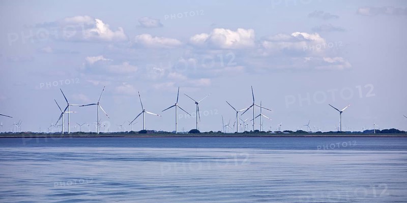 Schleswig-Holstein Wadden Sea National Park with a view of wind turbines on the mainland, North Frisia, Germany