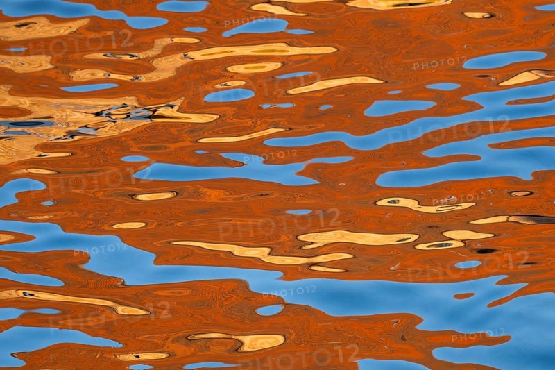 Colourful reflection on the water surface with abstract pattern, Frederiksholms Canal, Copenhagen, Denmark