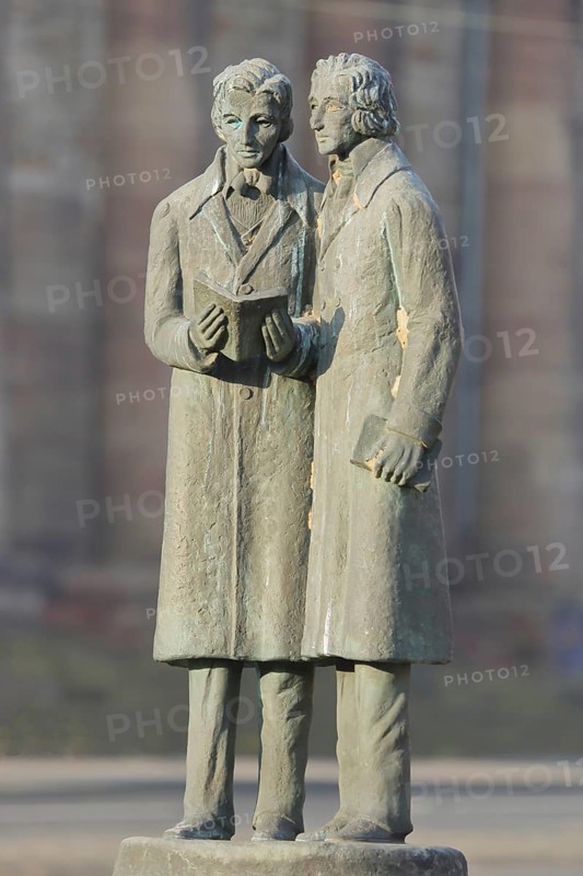 Brothers Grimm Monument, Jacob Grimm, Wilhelm Grimm, Brothers, bronze sculpture, two male figures standing with book in hand, reading, literature, Brothers Grimm Square, Kassel, Hesse, Germany