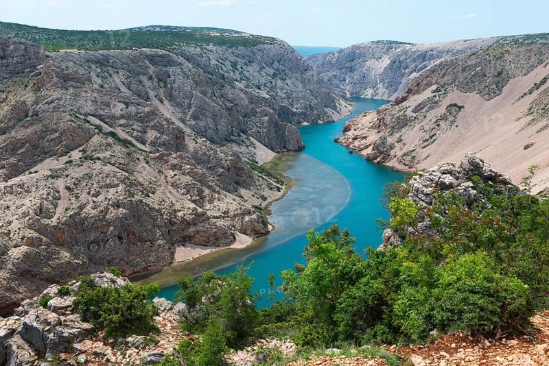 The river meanders through a stony gorge with turquoise blue water, surrounded by green trees, Pariževacka Glavica, Parizevacka, location of Karl May films, Zrmanja River, Jasenice, Zadar County, Croatia