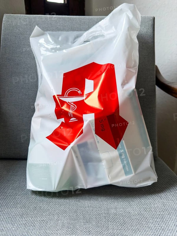 A plastic bag from a pharmacy filled with many medicines in Düsseldorf, Germany