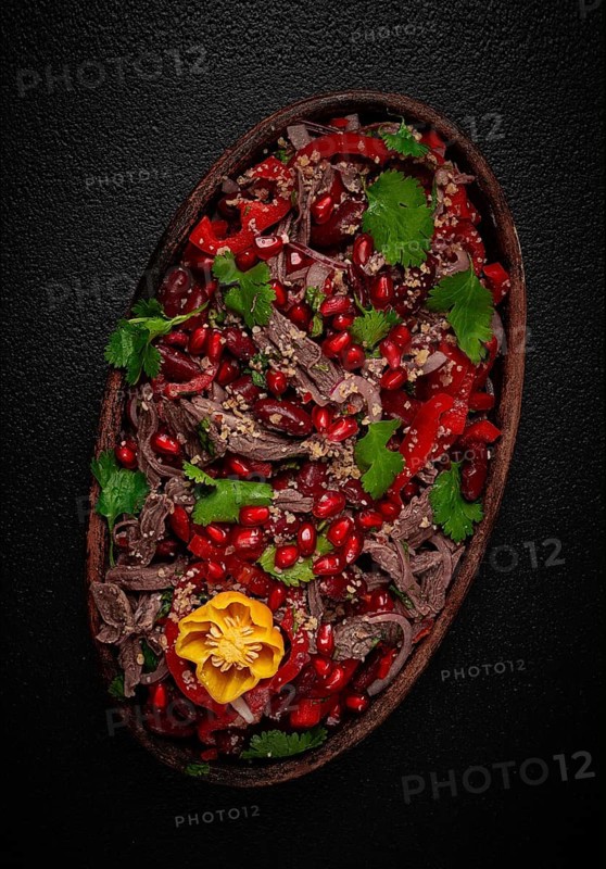Georgian salad Tbilisi, boiled beef, with red beans and onions, sweet pepper, walnut and pomegranate, homemade, no people