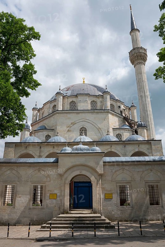 View of a mosque with a large dome and a high minaret surrounded by trees, Tombul Mosque, Sherif Halil Pasha Mosque, Serif Halil Pasa Mosque, Serif Halil Pasa Camii, important Ottoman building, Shumen, Shumla, Unesco World Heritage Site, Bulgaria