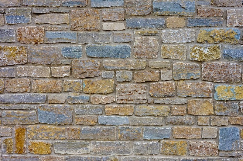 Natural stone wall with blue, grey discolouration and varied structure, Würzburg, Bavaria, Germany