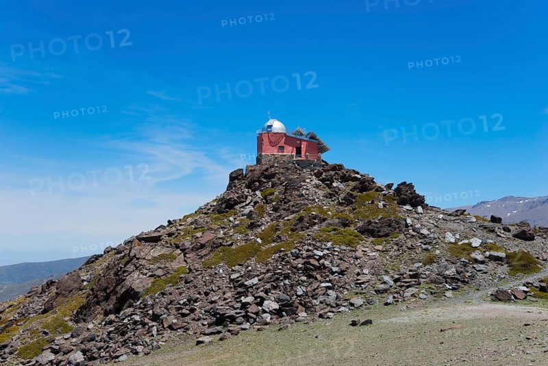 Red observatory building on a rocky hill under a blue sky, Obversatorium, Mohon del Trigo Observatorio, Observatorio del Mojón del Trigo, Güéjar Sierra, Güejar, Sierra Nevada, Andalusia, Spain