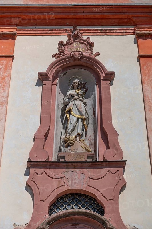 Sculpture of the Virgin Mary above the entrance portal of the baroque St Martin's Church, Riegel am Kaiserstuhl, Baden-Württemberg, Germany