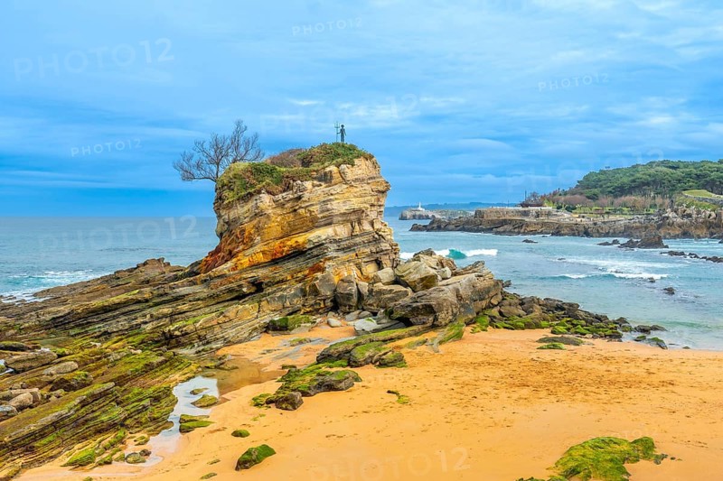 Monument to Neptune Child (Ramon Muriedas) on Camello beach in Santander, Cantabria, Spain