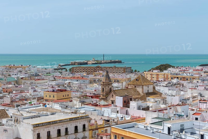 View of the Castillo de San Sebastian, from the Torre Tavira tower over the historic centre of Cádiz, Spain