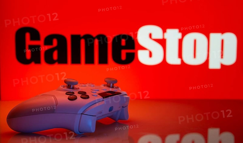Dhaka, Bangladesh- 15 July 2025: Game controller in front of GameStop logo on a background