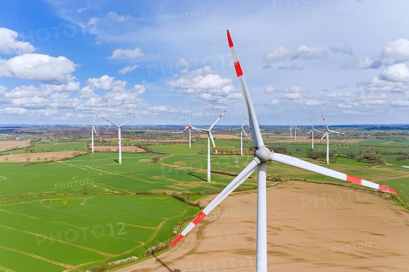 Aerial view over wind turbines at wind park, windfarm in Schleswig-Holstein, Germany