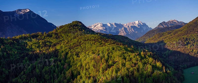 Aerial view, panorama, trees, forest, light green leaves, morning light, mountains, sunny, spring, near Murnau, Zugspitze, Wetterstein range, foothills of the Alps, Bavaria, Germany