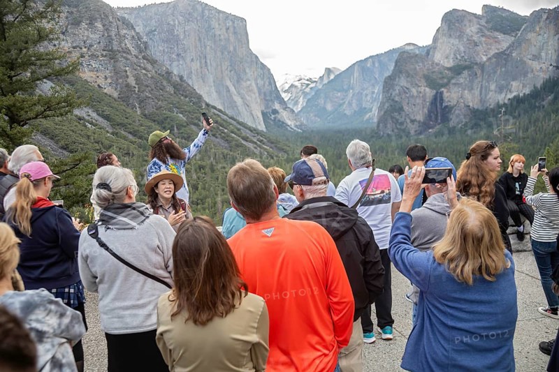 Yosemite National Park, California - A park ranger talks to tourists at the western entrance to Yosemite Valley in Yosemite National Park