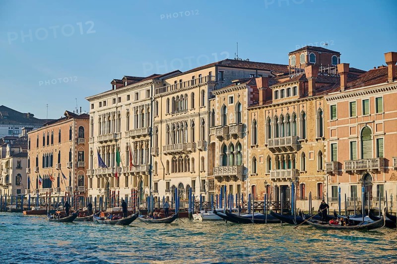 View from 'Canal Grande' on the houses and boats lying in the water in Venice on a sunny day in winter, Italy