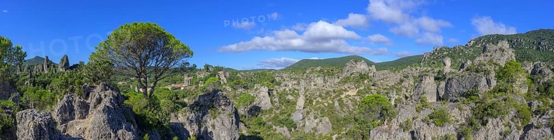 Panorama of the rock labyrinth and view of the village of Mourèze, Département Hérault, France