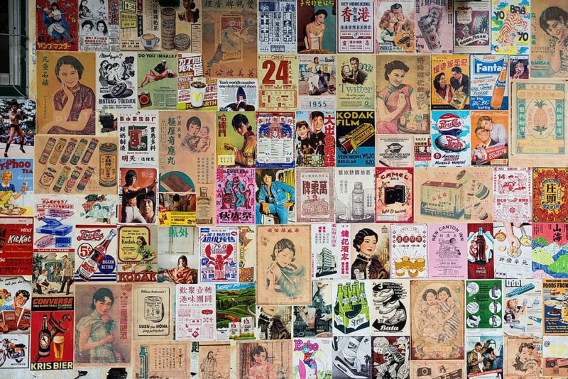 House wall with old posters and advertising, Chinatown, Bangkok, Thailand
