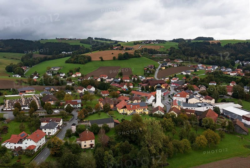 Drone shot, view of village with church, Enzenkirchen, Innviertel, Upper Austria, Austria