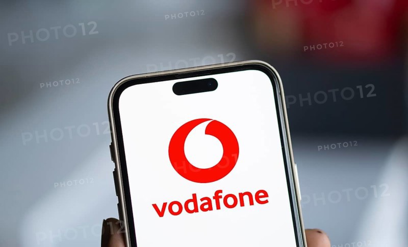 Vodafone logo is displayed on smartphone.