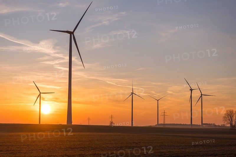 Sunset landscape with several wind turbines in the foreground, near Ulm, Swabian Alb, Baden-Württemberg, Germany