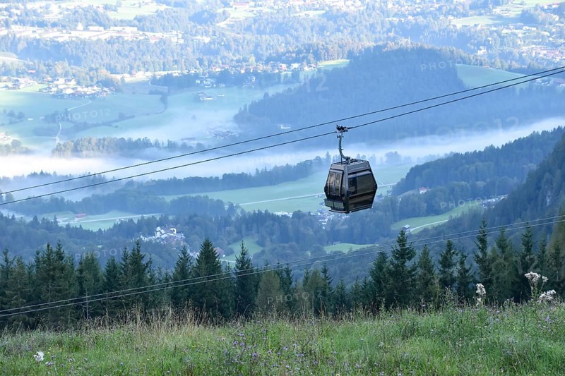 Gondola of the Jennerbahn in front of the valley basin of Berchtesgaden with fog in the early morning, Bavaria, Germany