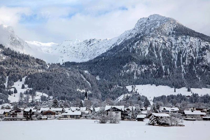 Winter, snowy landscape, view of Oberstdorf, behind Schattenberg and ORLEN Arena, ski jumping arena, Oberallgäu, Allgäu, Bavaria, Germany