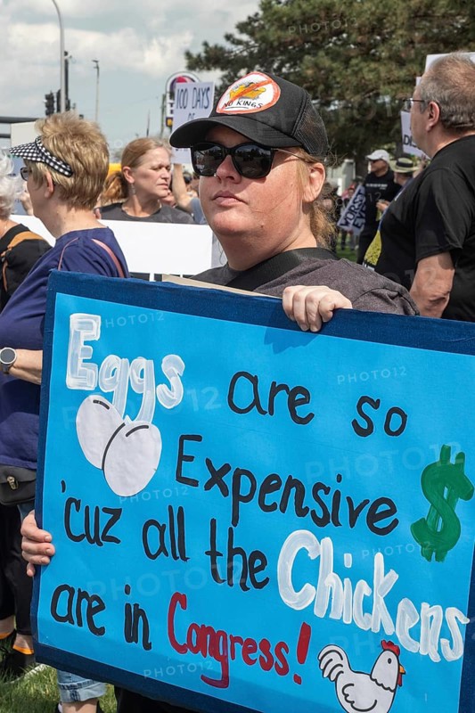 Warren, Michigan USA - 29 April 2025 - Thousands of protesters showed up to 'unwelcome' President Donald Trump who celebrated his first 100 days in office with a rally at Macomb Community College. The protesters cited government funding cuts which have cost jobs, health care, retirement, and more