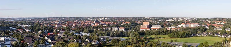 Panorama of the city view from the north-east with district administration office, Jakobikirche, Donatsturm, Nikolaikirche, cathedral, Petrikirche and building of the TU Bergakademie, Freiberg, Saxony, Germany