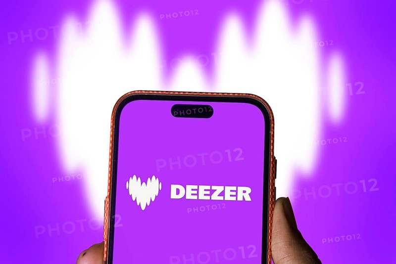 deezer logo is displayed on smartphone. Deezer is a French music streaming service