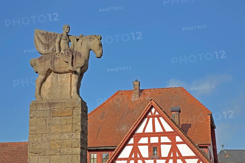 War memorial with equestrian figure from World War 1, equestrian statue, horse figure, half-timbered house, column, Göllheim, Rhineland-Palatinate, Germany