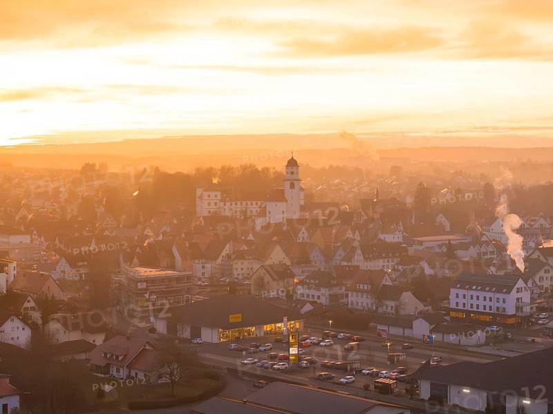 Panorama of a town at dusk, bathed in warm colours by the sunset, Meßkirch, Sigmaringen district, Germany