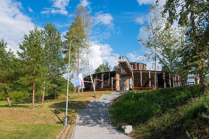 Round wooden building surrounded by trees, in sunny weather and clear sky, brine, graduation tower, spa town of Milomlyn, Milomlyn, Lviv, Warmia-Mazury, Poland