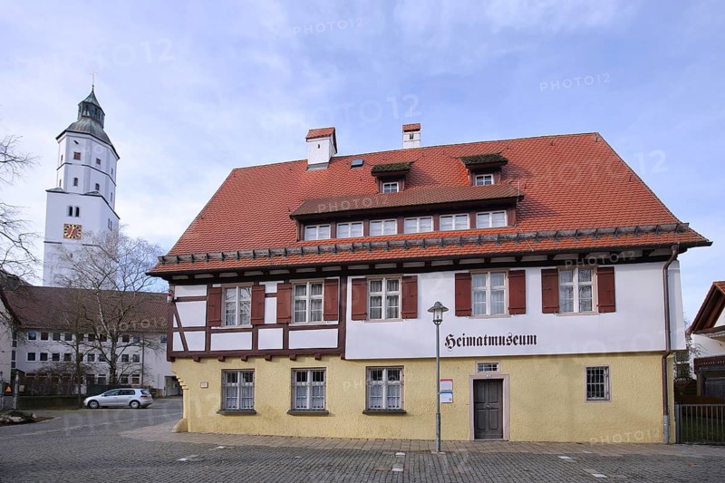 Local history museum built in the 16th century and church tower of St Martin's Church, landmark, half-timbered house with inscription, Langenau, Alb-Donau district, Swabian Alb, Baden-Württemberg, Germany