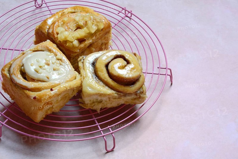 Cinnamon buns on a cake rack, pastries