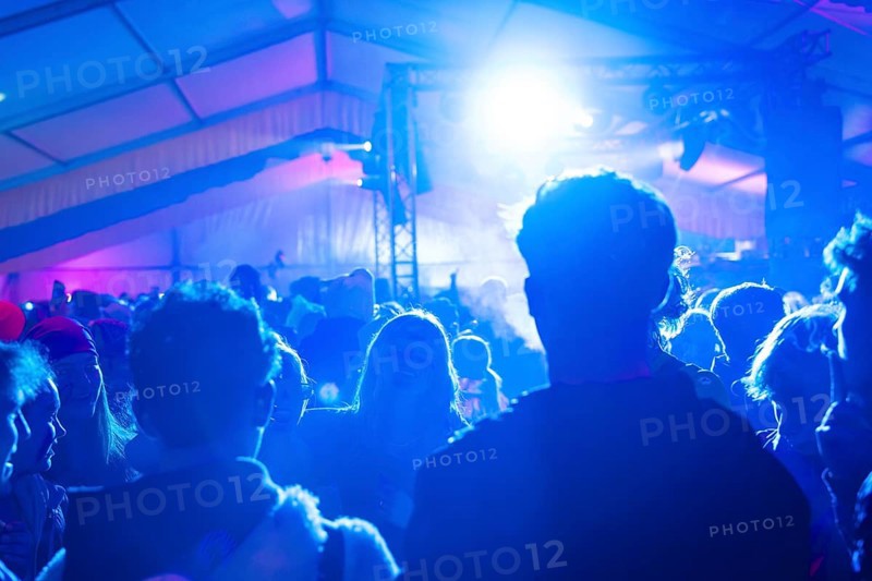 Party in full swing with blue lights and dancing people, carnival, Schlagerkuchen Donzdorf, Landkreis Göppingen, Germany