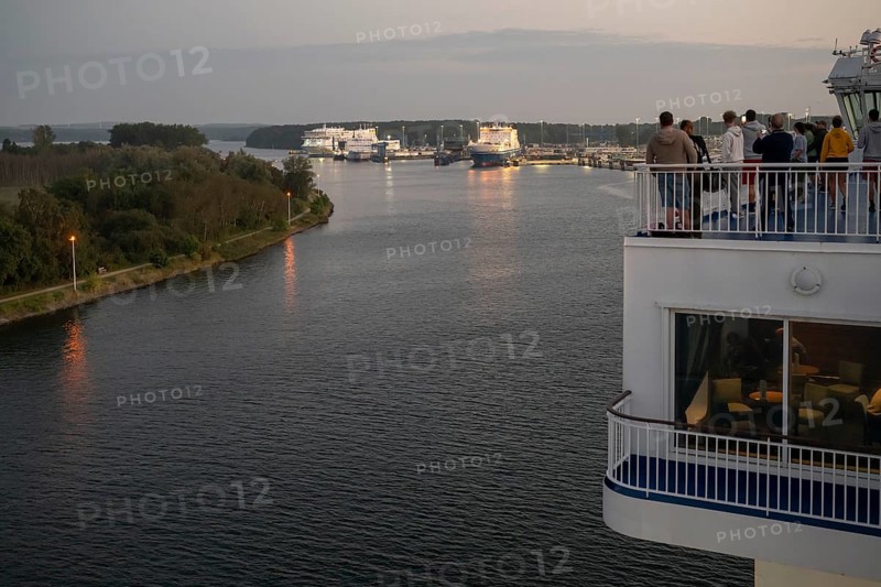 Travellers follow the Finnish ferry entering the port of Travemünde, Bay of Lübeck, Lübeck, Schleswig-Holstein, Germany