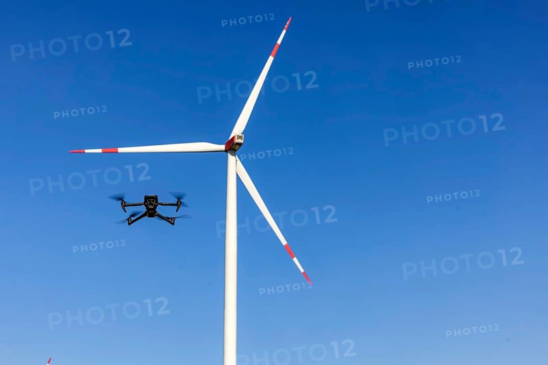 A Mavic 3 Pro drone flies for a wind turbine in a wind farm. Dornstadt, Baden-Württemberg, Germany