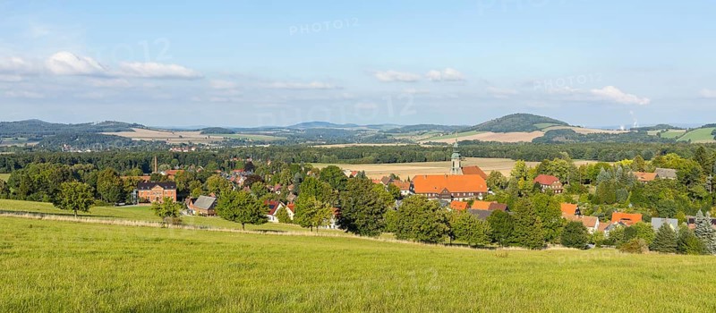 View of the village from the Sängerhöhe with church, school and half-timbered houses, in the background Hainewalde and the Breiteberg, Waltersdorf, Großschönau, Saxony, Germany