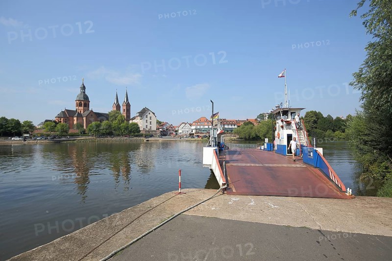 View of the Main and Einhard Basilica of St. Marcellinus and Peter, ferry, monastery complex, Seligenstadt, Main, Hesse, Germany