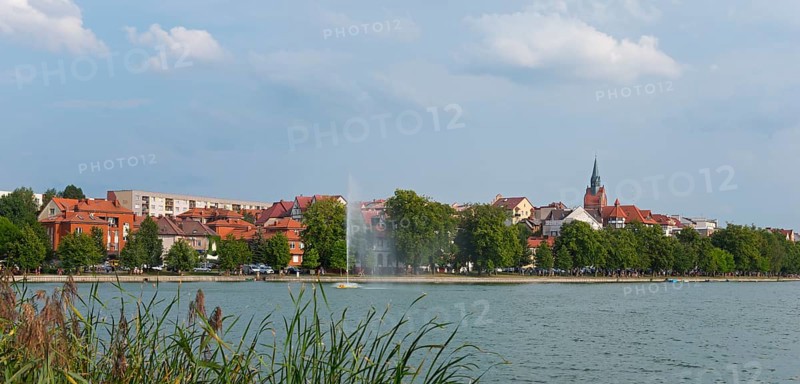 Panorama of a lakeside town with church tower and trees, central fountain, summer scenery, Elk, Elk, Lyck, Jezioro Elckie, Warmia-Masuria, Poland