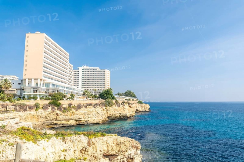 Breathtaking hotels perched on a cliff overlooking the turquoise mediterranean waters in cales de mallorca, manacor