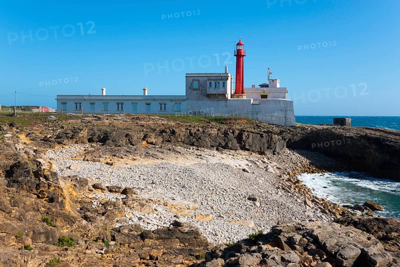 Lighthouse on rocky coast with clear sky and sea view, Farol do Cabo Raso, São Brás de Sanxete fortress, Estoril, Cascais, Parque Natural de Sintra-Cascais, Portugal