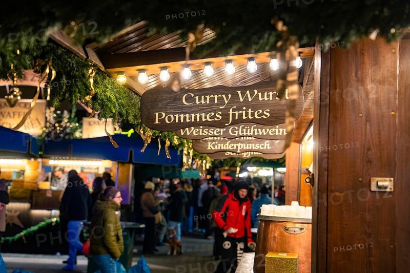 A food stall at a Christmas market with winter lighting, Christmas market Ludwigsburg, Germany