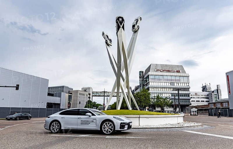 Porscheplatz Zuffenhausen with Porsche headquarters. Artwork Inspiration 911 by Gerry Judah with three steles, each presenting a Porsche 911. Stuttgart, Baden-Württemberg, Germany