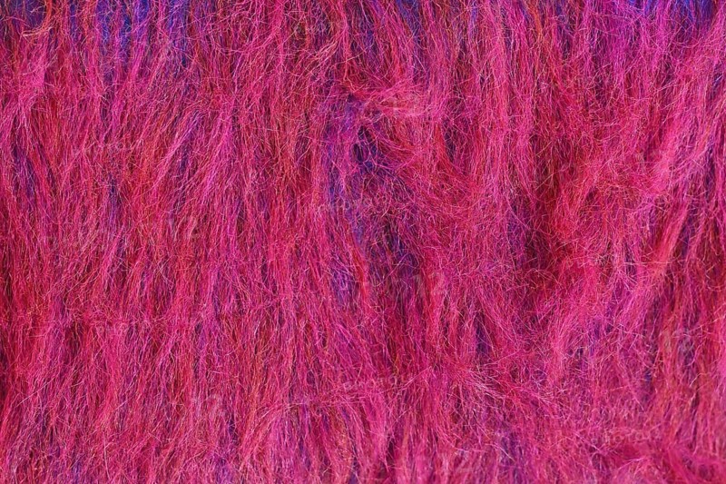 Close up of bright red and purple synthetic fake fur