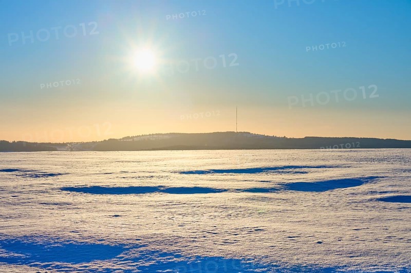 Wide snowy landscape under glistening sun and clear sky, winter, Heidelstein, Wasserkuppe, Gersfeld, Rhön, Hesse, Germany